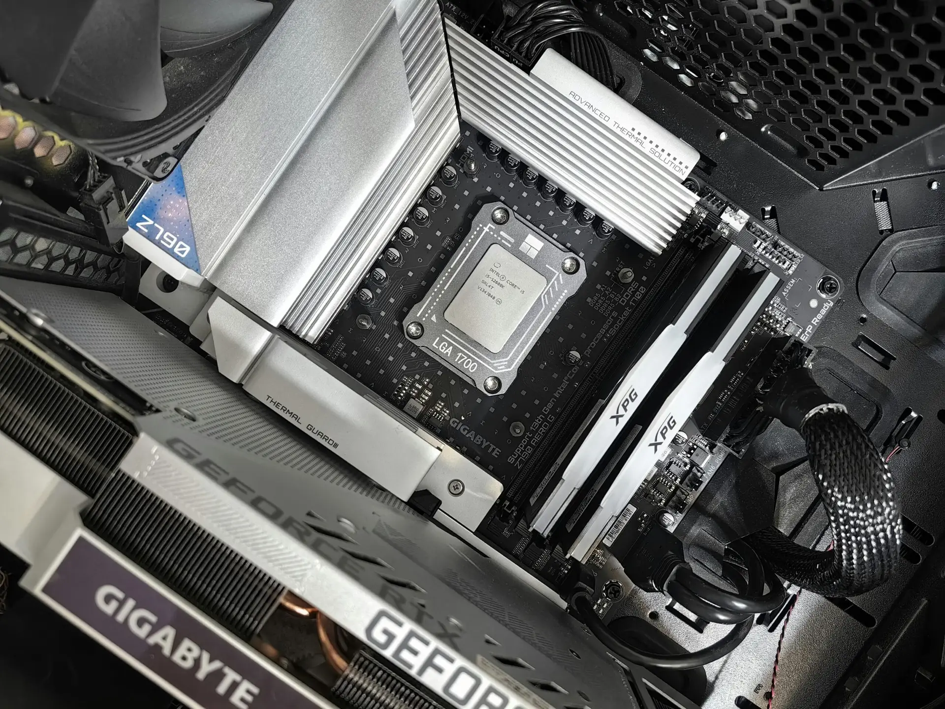 Interior view of a high-performance PC build featuring a Gigabyte motherboard and components.